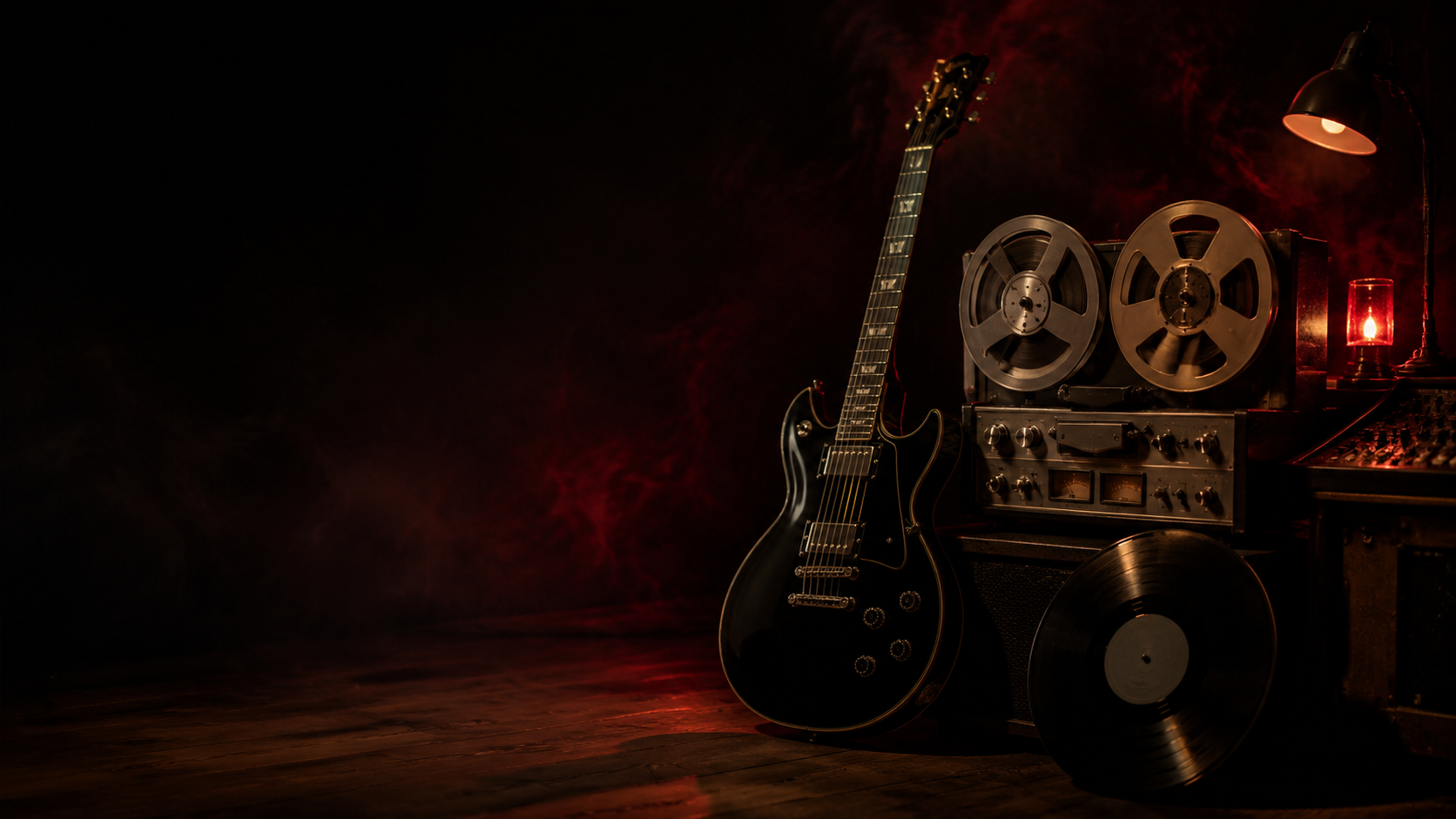 A black electric guitar, reel-to-reel deck, and vinyl record in a midnight recording studio